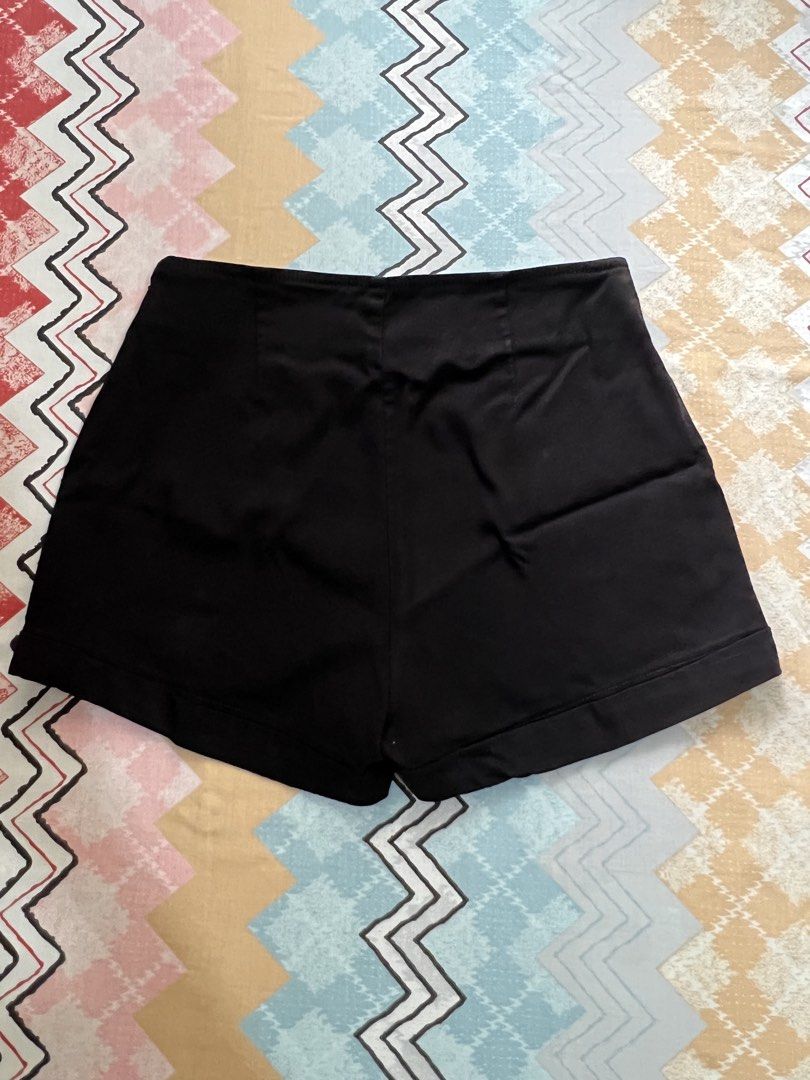 Guess Black High-Waisted Button Front Shorts (Category: Shorts) located in Caloocan City. Submitted by allotherthings26 (Listing ID 1461561636, Image 2). Description: - Guess black high-waisted shorts - Features gold-toned button-front detail - Plain back design - Perfect for dressing up or down - Comfortable fit.