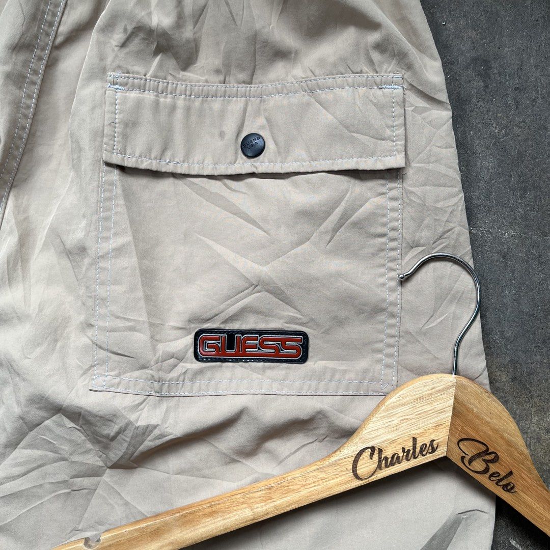 Guess Cargo Pants Beige Drawstring Waist (Category: Chinos) located in Davao. Submitted by charlesole52665 (Listing ID 1461390227, Image 3). Description: - Guess beige cargo pants - Waistline: 28-32 on tape - Length: 41 inch - Leg Opening: 9.5 - Elasticated drawstring waist - Multiple pockets with button closures - Adjustable drawstring at the ankles - Ideal for casual wear.