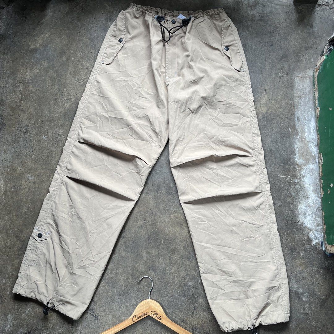 Guess Cargo Pants Beige Drawstring Waist (Category: Chinos) located in Davao. Submitted by charlesole52665 (Listing ID 1461390227, Image 2). Description: - Guess beige cargo pants - Waistline: 28-32 on tape - Length: 41 inch - Leg Opening: 9.5 - Elasticated drawstring waist - Multiple pockets with button closures - Adjustable drawstring at the ankles - Ideal for casual wear.