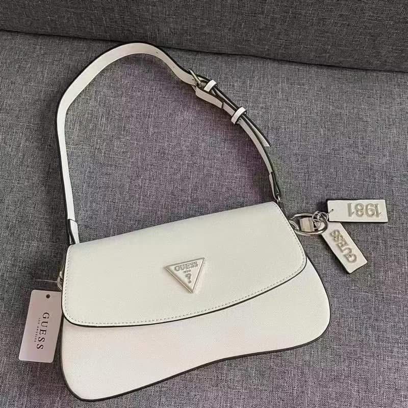 Guess Shoulder Bag - Multiple Colors Available (Category: Shoulder Bags) located in Taytay. Submitted by pureriver.ef6f49 (Listing ID 1461557760, Image 3). Description: Stylish Guess shoulder bags in black, white, brown, and monogram. Fits daily essentials. Features Guess logo and adjustable sling and shoulder strap All colors onhand Loc Cainta Rizal Shop now!.