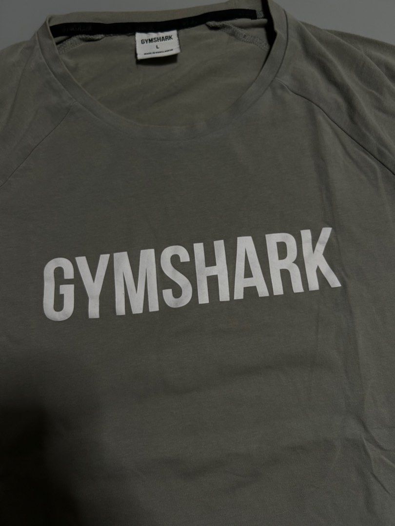Gym shark drifit shirt (authentic) (Category: Activewear) located in Trece Martires City. Submitted by flip_flips (Listing ID 1461467611, Image 2). Description: Gym shark drifit shirt (authentic) -Large on tag -Dimes: 21 width 27 length -Excellent condition -9.5/10 color rate -issue: mino washable stain.
