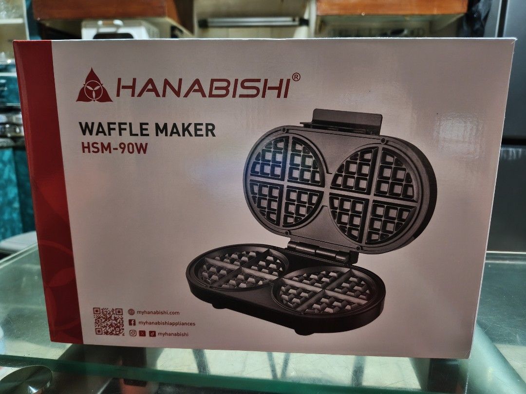 Hanabishi Waffle Maker HSM-90W (Category: Other Kitchen Appliances) located in Makati City. Submitted by anjelincloset (Listing ID 1461381634, Image 1). Description: Hanabishi Waffle Maker (Model: HSM-90W) - Makes 8 delicious Belgian waffles - Non-stick surface for easy cleaning - Pilot lights indicate power and heating status - Heat-insulated handle for safe operation - Thermal fuse protection for added safety - Rated Voltage: 230V - SRP: Php183