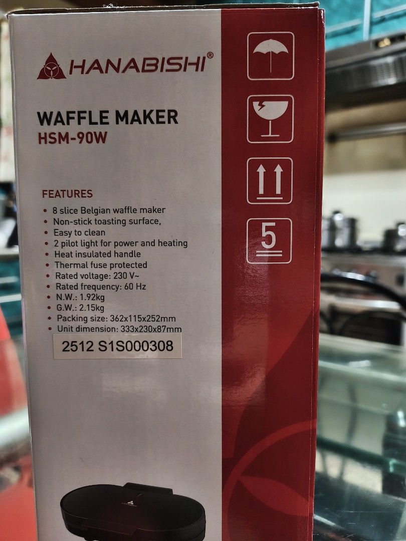 Hanabishi Waffle Maker HSM-90W (Category: Other Kitchen Appliances) located in Makati City. Submitted by anjelincloset (Listing ID 1461381634, Image 2). Description: Hanabishi Waffle Maker (Model: HSM-90W) - Makes 8 delicious Belgian waffles - Non-stick surface for easy cleaning - Pilot lights indicate power and heating status - Heat-insulated handle for safe operation - Thermal fuse protection for added safety - Rated Voltage: 230V - SRP: Php183