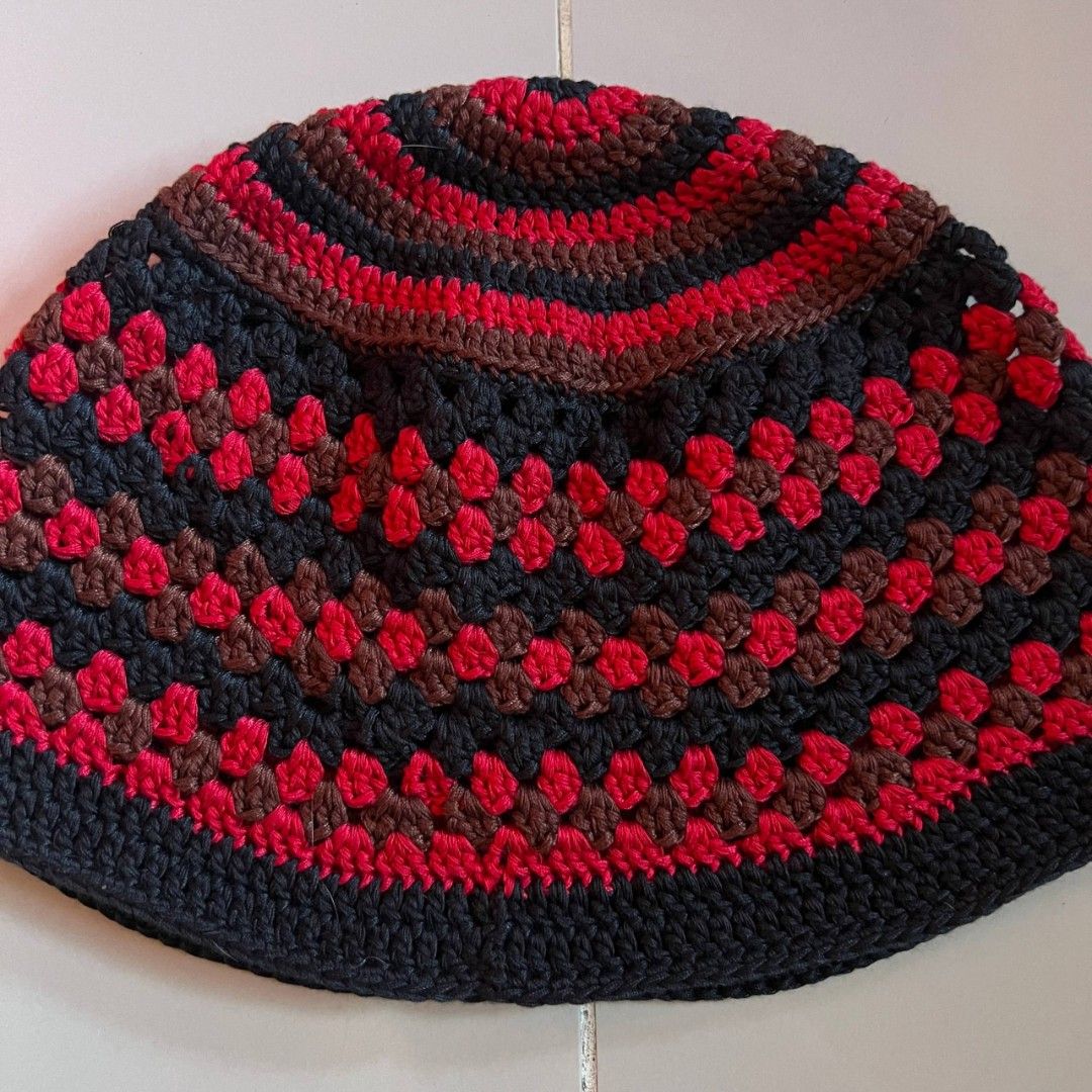 Handmade Crochet Bucket Hat - Black, Red, Brown (Category: Caps & Hats) located in General Trias. Submitted by wear_whimsy (Listing ID 1461390062, Image 2). Description: - Handmade crochet hat - Features a classic granny square pattern - Colors: Black, Red, and Brown.