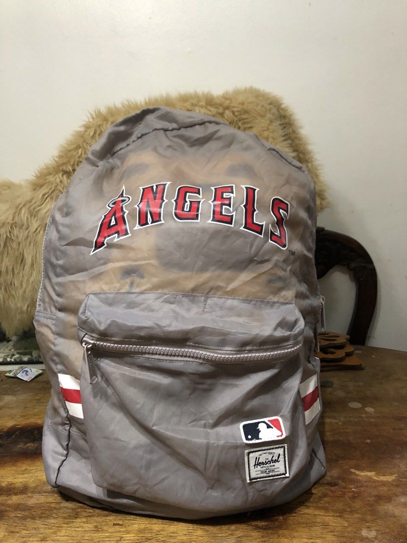 HERSCHEL MLB BAG (Category: Backpacks) located in Quezon City. Submitted by bettymeir07 (Listing ID 1461541950, Image 2). Description: This is a Grey Herschel Supply Co. Packable Daypack featuring the Los Angeles Angels MLB team logo and red-and-white accent stripes. -In good condition -PRICE NEGOTIABLE MOP: GOTYME or GCASH.