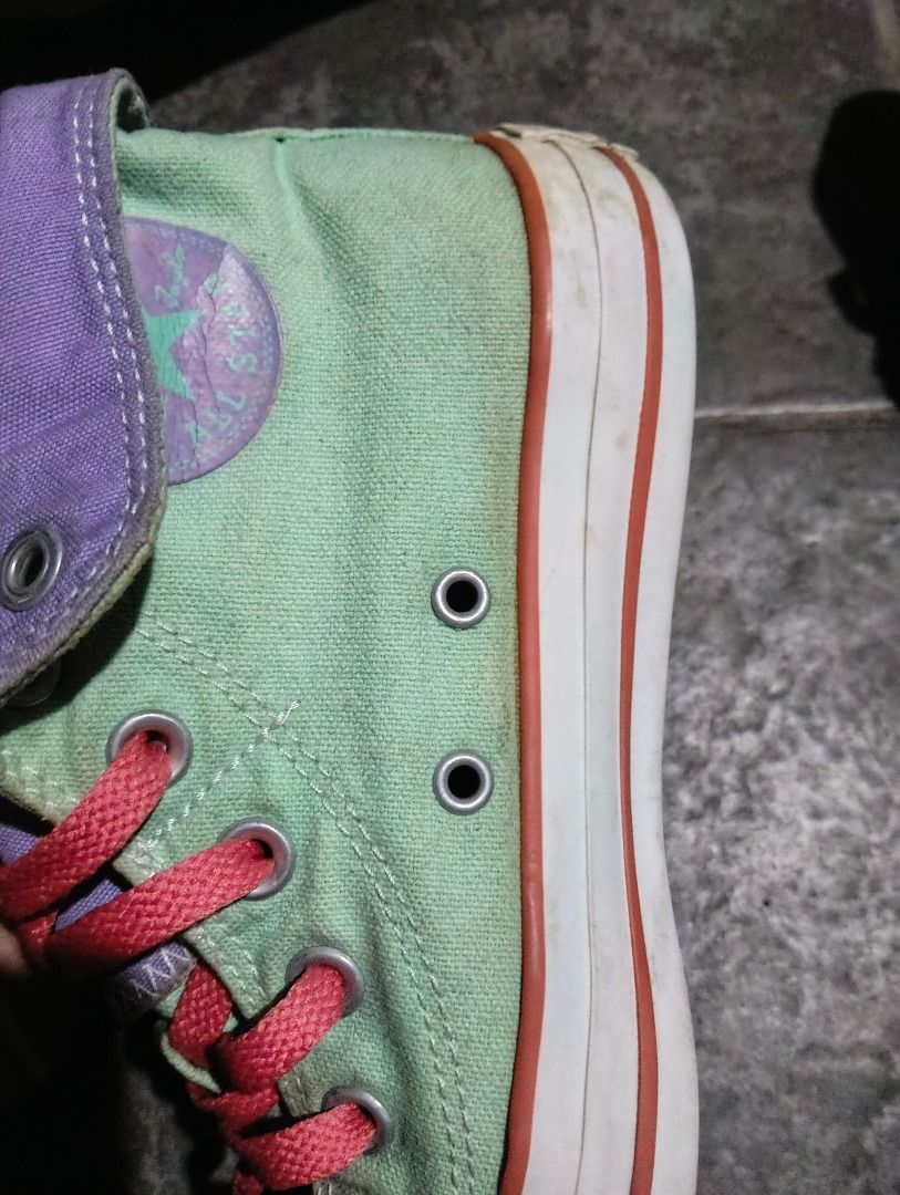 High Cut Shoes (Category: Sneakers) located in Antipolo. Submitted by jocyong22 (Listing ID 1461463216, Image 2). Description: - Cool Converse high tops - Mint green with purple and pink accents - Lace-up style - Fold-down tongue reveals purple lining - Minor scuffs on soles and toe cap from normal wear - Plenty of life left -US &.