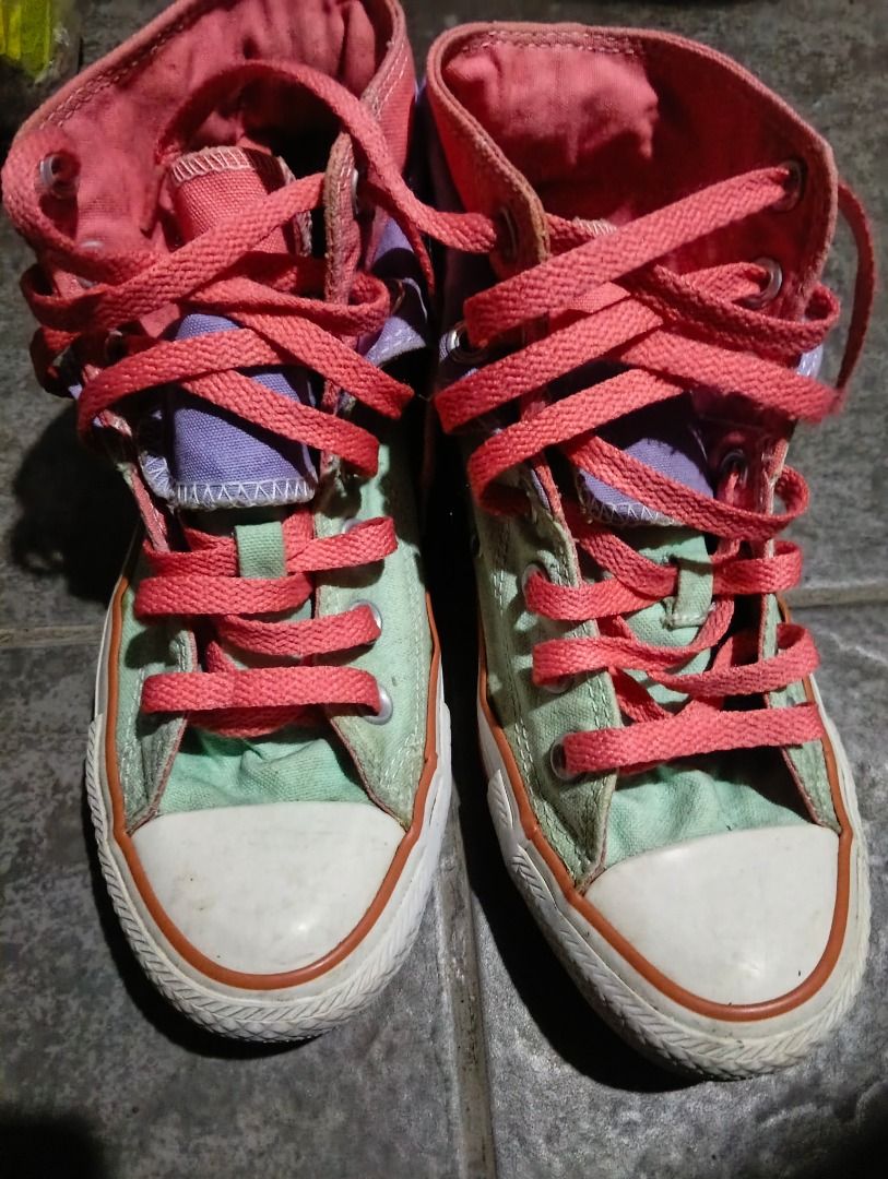 High Cut Shoes (Category: Sneakers) located in Antipolo. Submitted by jocyong22 (Listing ID 1461463216, Image 1). Description: - Cool Converse high tops - Mint green with purple and pink accents - Lace-up style - Fold-down tongue reveals purple lining - Minor scuffs on soles and toe cap from normal wear - Plenty of life left -US &.