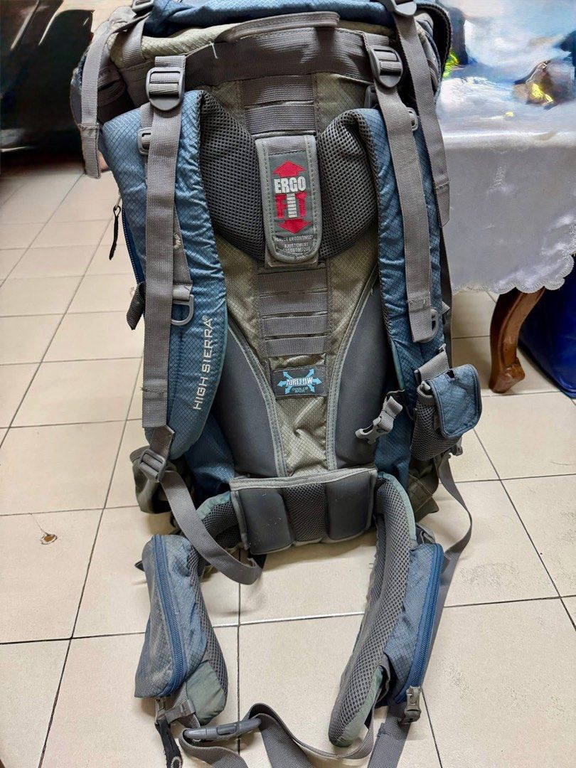 High Sierra Titan Backpack 65L (Category: Backpacks) located in Makati City. Submitted by avsilj (Listing ID 1461364778, Image 3). Description: - High Sierra Titan backpack - Color: Blue and Beige - Features ERGO adjustable back system for comfort - AIRFLOW cooling technology to keep you cool - Multiple straps and pockets for ample gear storage - Note: Some stains on the front, as pictured - Perfect for hiking adventures or travel.