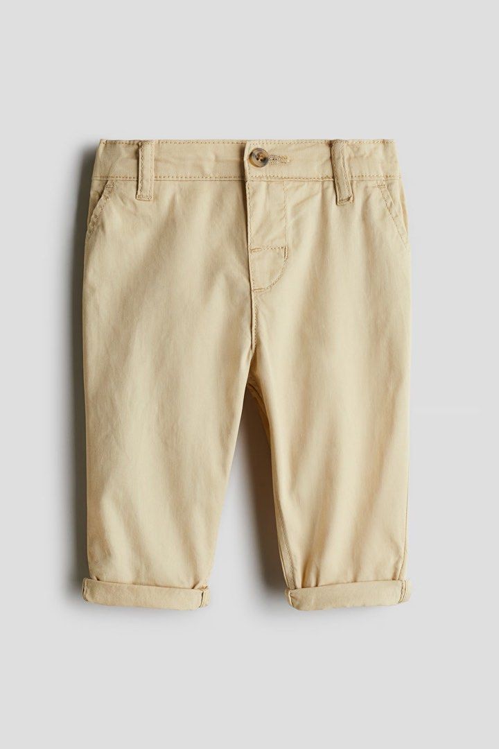 H&M cotton chinos (Category: Babies & Kids Fashion) located in Naga. Submitted by suit_yourslf (Listing ID 1461347883, Image 1). Description: - Cute beige chino pants for kids - Button closure - Belt loops - Cuffed hem for a stylish look - Versatile for casual or dressier occasions - Easy to pair with various tops.