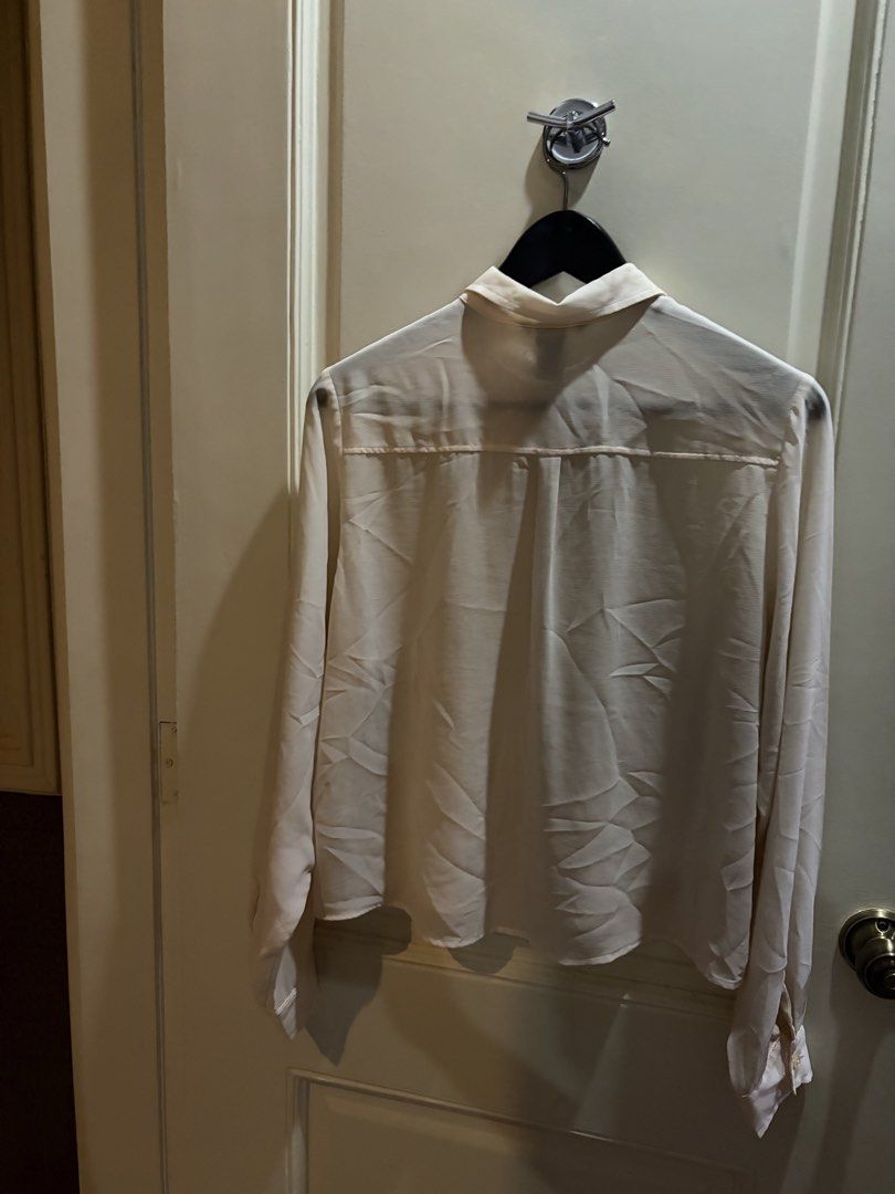 H&M Cream Long Sleeve Button Up Shirt (Category: Longsleeves) located in Muntinlupa City. Submitted by secondhandlove12345 (Listing ID 1461509808, Image 3). Description: - Cream colored long sleeve shirt - Brand: H&M - Features a single pocket on the left chest - Button-up front - Made in Turkey - Size: EUR 36 - Versatile for casual or work attire Pick up buyer Negotiable .