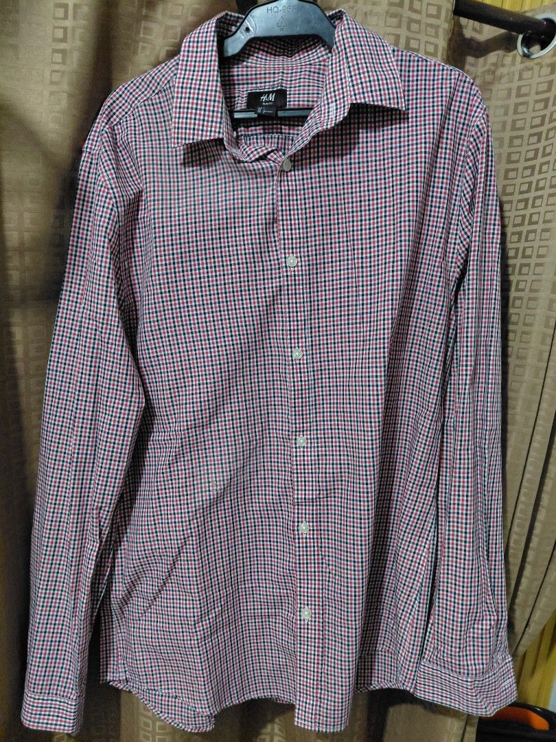 H&M Men's Checked Long Sleeve Shirt (Category: Tshirts & Polo Shirts ) located in Quezon City. Submitted by maxdom (Listing ID 1461507206, Image 1). Description: - Classic checked long sleeve shirt from H&M - Features a red, white, and navy blue checkered pattern - Button-up front with a collar - Versatile for casual or smart-casual outfits - Comfortable and sharp looking.