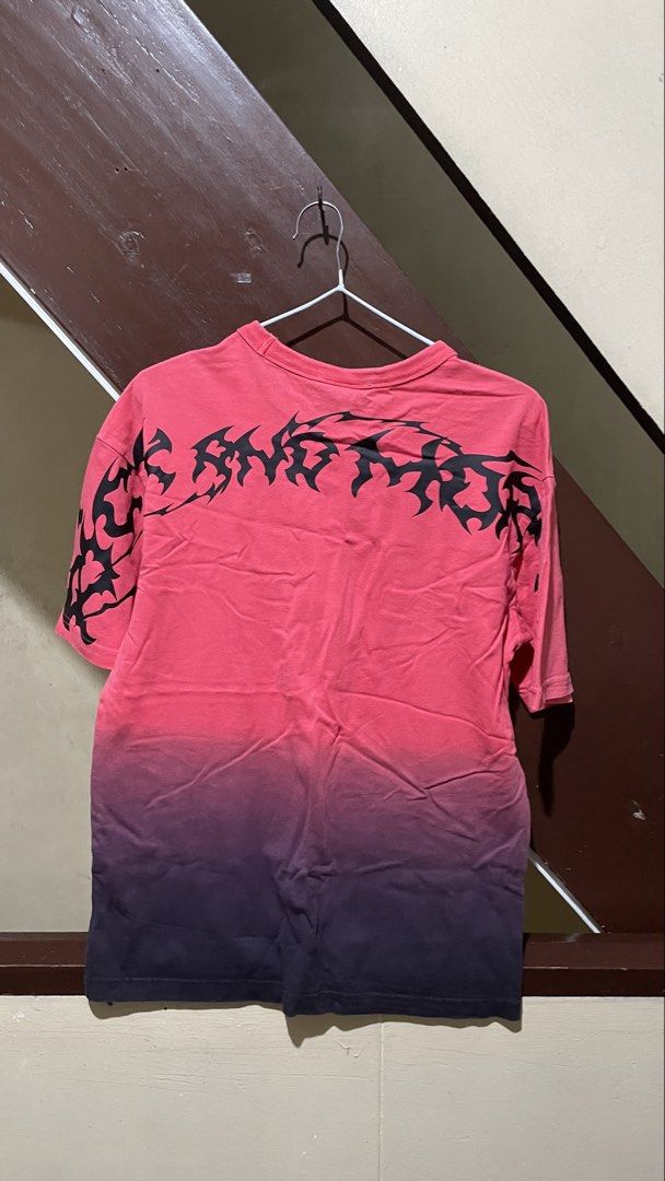 H&M Morty Smith Red T-shirt (Category: Tshirts & Polo Shirts ) located in Manila. Submitted by round_0000 (Listing ID 1461417425, Image 2). Description: - H&M T-shirt featuring a cool Morty Smith graphic - Eye-catching pink to purple gradient colorway on the front - Unique tribal-like graphic design on the back - Made from comfortable, soft material - Ideal for fans of the show Actual product color may vary slightly from the photos shown. The sel