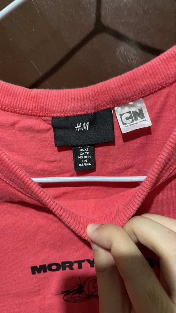 H&M Morty Smith Red T-shirt (Category: Tshirts & Polo Shirts ) located in Manila. Submitted by round_0000 (Listing ID 1461417425, Image 3). Description: - H&M T-shirt featuring a cool Morty Smith graphic - Eye-catching pink to purple gradient colorway on the front - Unique tribal-like graphic design on the back - Made from comfortable, soft material - Ideal for fans of the show Actual product color may vary slightly from the photos shown. The sel