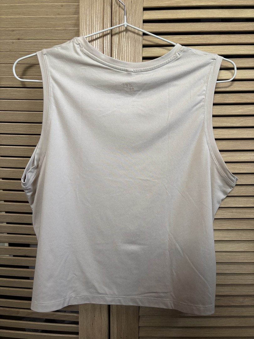 H&M Move DryMove Tank Top (Category: Sleeveless) located in Antipolo. Submitted by jeremmeeldeleon (Listing ID 1461423128, Image 2). Description: - H&M Move Tank Top - Color: Light Beige - Fabric: DryMove (great for workouts & casual wear) - Design: Sleeveless - Size: XS - Features: Subtle logo detail on the back.