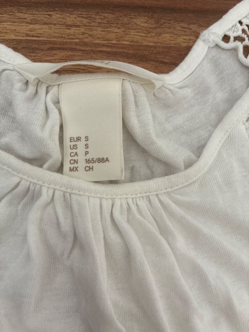 H&M White Lace Cap Sleeve Top Size S (Category: Blouses) located in Pasig City. Submitted by slr1949 (Listing ID 1461560976, Image 2). Description: - White H&M top - Cap sleeves with pretty lace detail - Round neckline with gathering - Simple and light fabric - Ideal for casual wear.