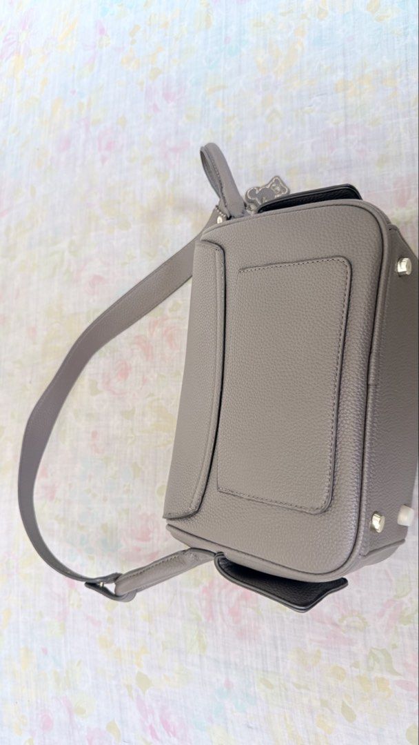 HOLB bag/sling (Category: Cross-body Bags) located in Cebu City. Submitted by chiquikayy (Listing ID 1461360289, Image 3). Description: - bought this around 2k ++ online - well used with signs of usage - Stylish grey leather crossbody bag - Secure flap closure with silver logo detail - Adorable embroidered bear inside - Adjustable strap for comfortable wear - Durable metal feet on the bottom - Ideal for everyday use.