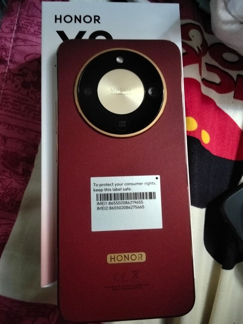 HONOR X9 Smartphone - Burgundy (Category: Android Others) located in Navotas City. Submitted by fererway47591 (Listing ID 1461333368, Image 3). Description: - Brand NEW with original box. Just bought on 9/11/2026, original price P21,999 - HONOR X9 Phone - Stunning Burgundy Color - Unique Circular Camera Module - In-Display Fingerprint Sensor - Original Box Included .