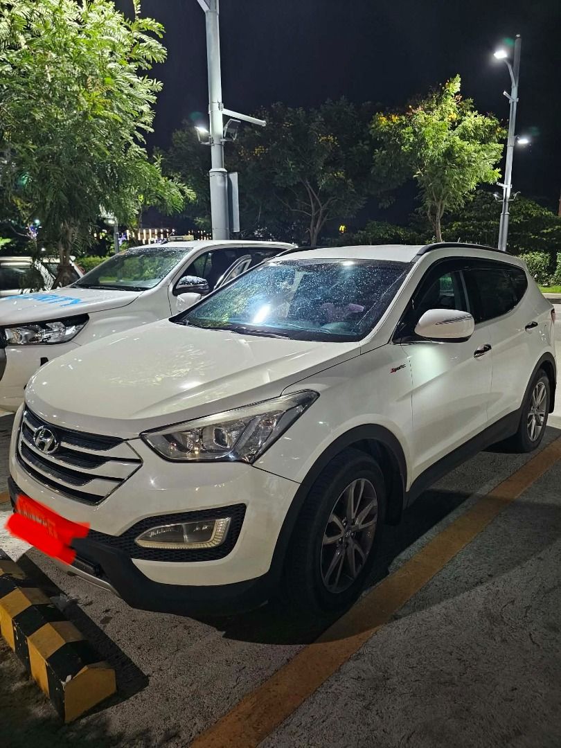 Hyundai Santa Fe 2.4 (A) (Category: Used Cars) located in Caloocan City. Submitted by nobletiger.6c6f9a (Listing ID 1461497081, Image 1). Description: RUSH 2013 Hyundai Santa Fe · Suv · Driven 65,000 kilometers FOR SALE: 2013 Hyundai Santa Fe 2.2 CRDi 🔥 DETAILS: ✅ 2.2L CRDi Turbo Diesel – matipid at malakas ✅ Automatic Transmission ✅ Color: vanilla white ✅ 7–8 Seater ✅ Push Start / Smart Key ✅ Bluetooth Hands-Free & Audio Controls on Steering Wh