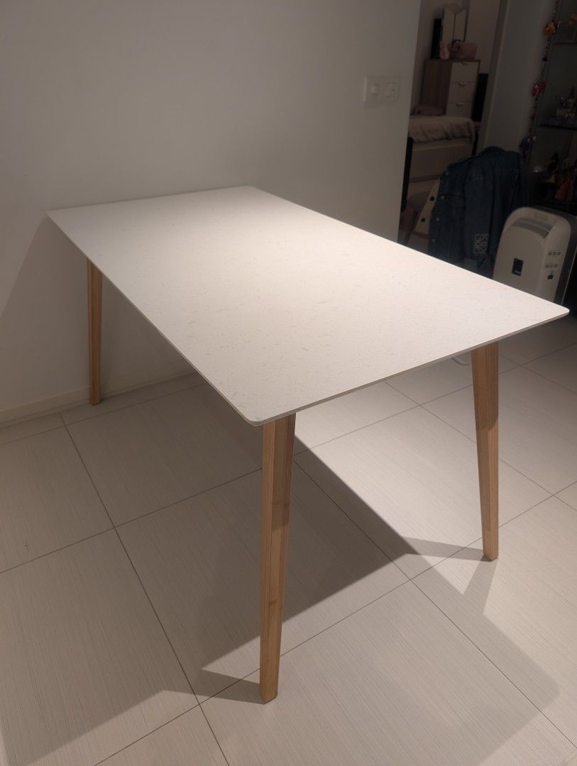 IKEA Stenared Table (Category: Tables & Sets) located in Singapore. Submitted by itsbryant (Listing ID 1461464284, Image 2). Description: 140 x 75 x 74 cm (LWH) Selling because I'm moving! Had for ~ 1 years, some scuffing on edges (pictured) but otherwise practically new. Already disassembled but all tools, parts, and instructions included (current new table is $499). Chairs sold separately. - Modern white speckled tabletop - Light wood legs - Se