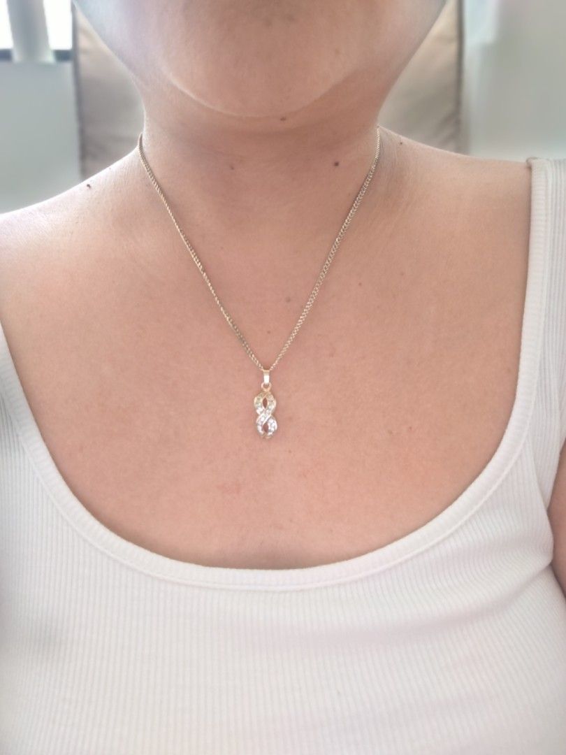 Infinity Pendant Necklace with Crystals (Category: Necklaces) located in Antipolo. Submitted by goodsinger (Listing ID 1461498335, Image 1). Description: - Gold-tone necklace - Infinity symbol pendant with clear crystals - Delicate and fine chain - Ideal for everyday wear or adding sparkle - Simple and classic design.