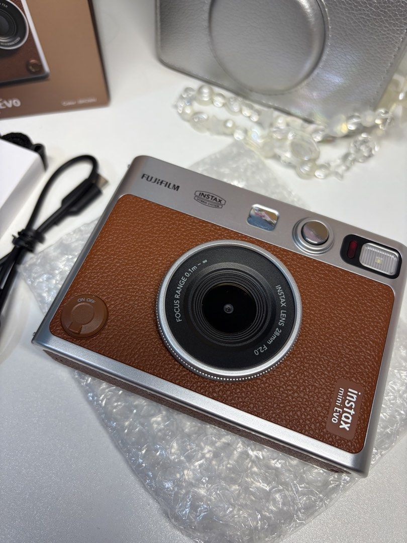 instax mini evo brown (Category: Cameras) located in Manila. Submitted by alouisa.o (Listing ID 1461497153, Image 2). Description: FOR SALE instax mini evo wts lfb instax mini evo brown for 8.5k (still nego) condi: still good as new, cam screen with protection film loc: fairview mod: lalamove inclusions: * orig box with manual * orig strap (unused) * charging cable type c * camera case * 7 films inside the cam can send more pictures and sample ph