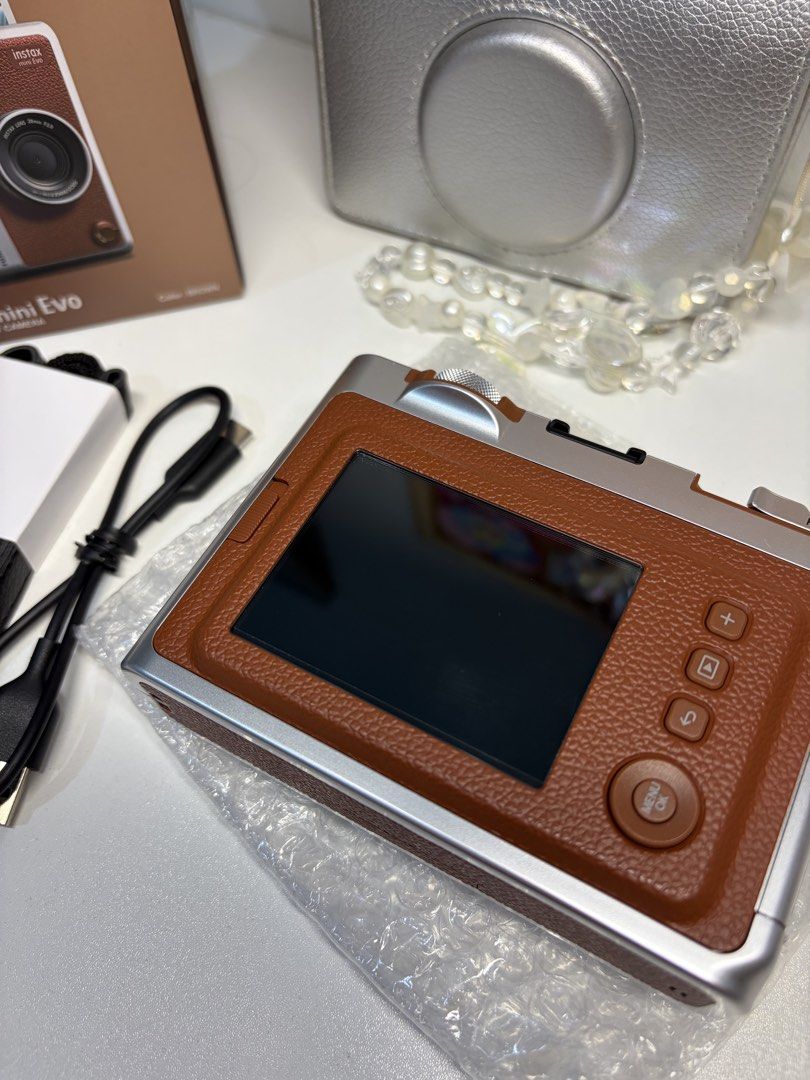instax mini evo brown (Category: Cameras) located in Manila. Submitted by alouisa.o (Listing ID 1461497153, Image 3). Description: FOR SALE instax mini evo wts lfb instax mini evo brown for 8.5k (still nego) condi: still good as new, cam screen with protection film loc: fairview mod: lalamove inclusions: * orig box with manual * orig strap (unused) * charging cable type c * camera case * 7 films inside the cam can send more pictures and sample ph