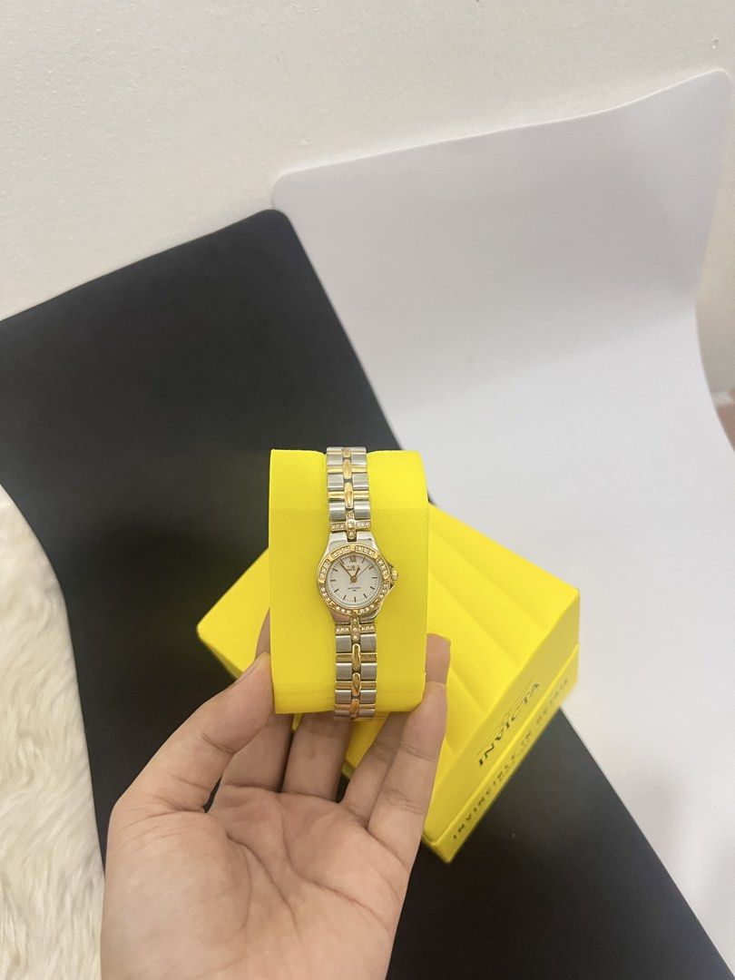 Invicta Watch Two-Tone Stainless Steel (Category: Women's Watches) located in Manila. Submitted by allysamaligaya28 (Listing ID 1461366916, Image 1). Description: - Invicta Watch - Two-tone stainless steel band - Classic, versatile design - Comes with original tag - Ideal for everyday wear or dressing up - Ready for a new owner.