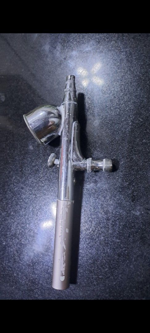Iwata Airbrush Japan XC (Category: Craft Supplies & Tools) located in Davao. Submitted by bravemoon_556cd5 (Listing ID 1461329993, Image 3). Description: - Genuine Iwata XC Airbrush - Made in Japan - Classic Chrome finish with Tan handle - Minor scuffs on handle, otherwise in good working condition - Ideal for detailed and precise painting projects.