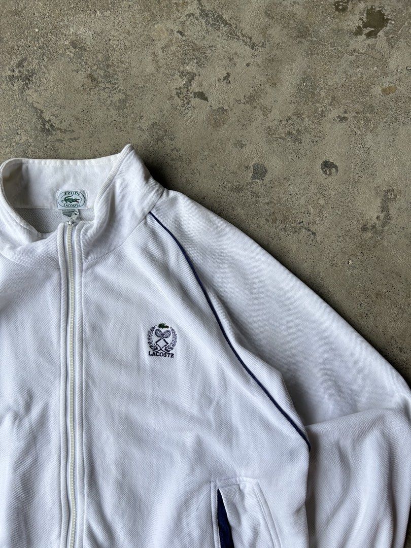 IZOD Lacoste White Tennis Track Jacket (Category: Hoodies) located in Santa Cruz. Submitted by uyaxxxxx (Listing ID 1461491796, Image 3). Description: - Classic white IZOD Lacoste track jacket Widht- 24 Lenght-28 Colorate 10/10 Need wash only issue no pm more details! 📩.