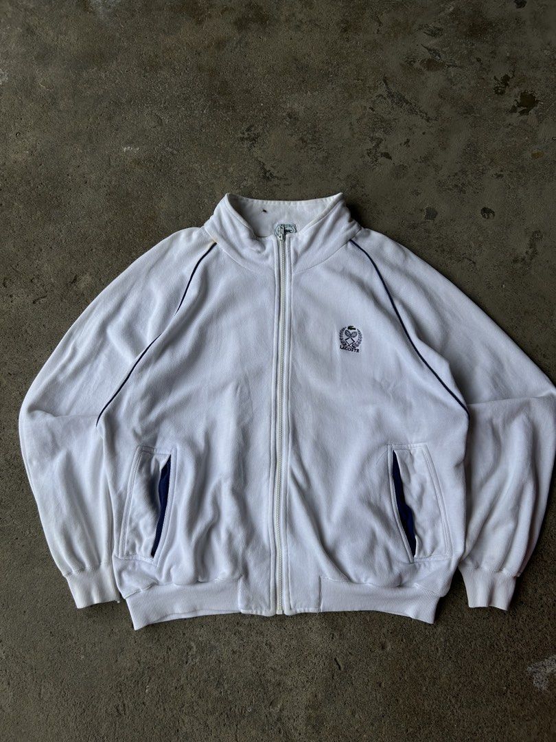 IZOD Lacoste White Tennis Track Jacket (Category: Hoodies) located in Santa Cruz. Submitted by uyaxxxxx (Listing ID 1461491796, Image 1). Description: - Classic white IZOD Lacoste track jacket Widht- 24 Lenght-28 Colorate 10/10 Need wash only issue no pm more details! 📩.