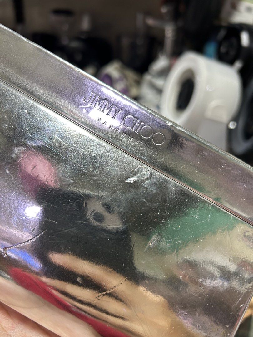 Jimmy Choo Parfums Silver Metal Box (Category: Fragrance & Deodorants) located in Manila. Submitted by starbalesukandjapansurplus (Listing ID 1461381798, Image 3). Description: - Authentic Jimmy Choo Parfums silver metal box. - Features minor scratches and a small dent on the side. - Please refer to the provided photos for detailed condition. - Ideal for storing small trinkets or as a unique collectible item..