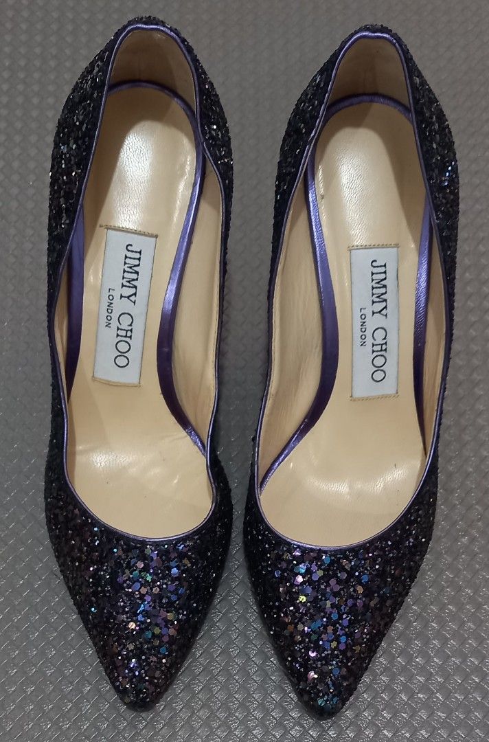 JIMMY CHOO Purple Glitter Heels Size 34 (Category: Heels) located in Cagayan de Oro. Submitted by edwardryan01984 (Listing ID 1461386121, Image 3). Description: - Brand: Jimmy Choo - Color: Dark purple glitter with purple trim and heel detail - Style: Pointed toe heels - Origin: Made in Italy - Size: 34 - Perfect for dressing up any outfit.