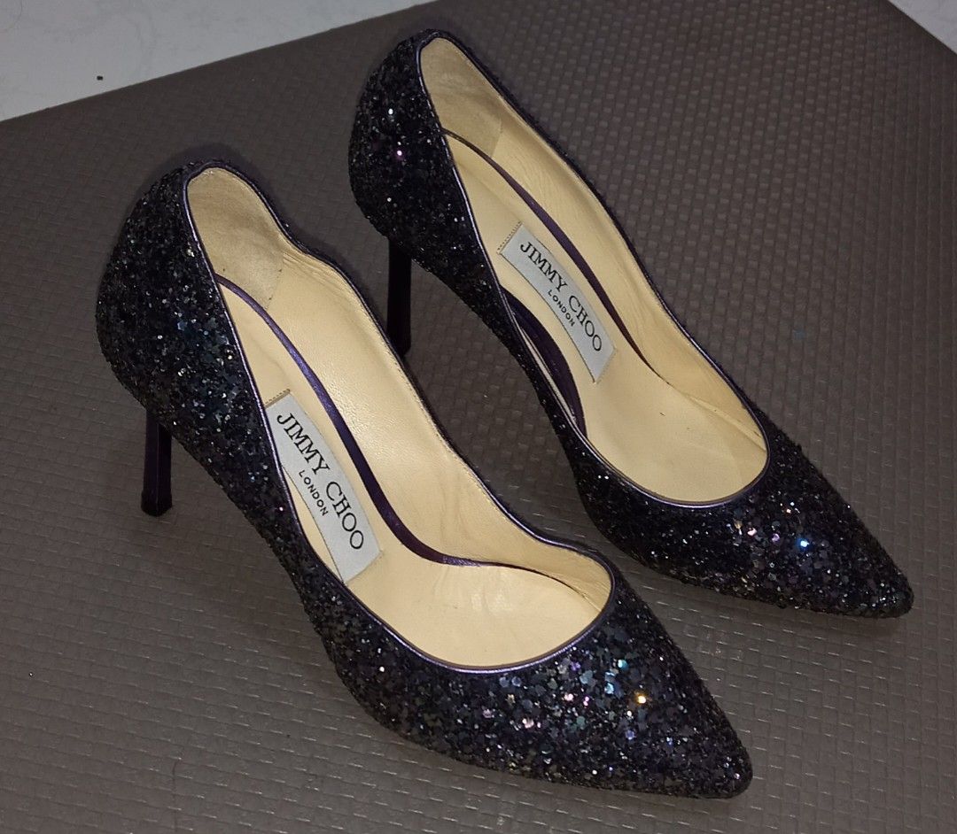 JIMMY CHOO Purple Glitter Heels Size 34 (Category: Heels) located in Cagayan de Oro. Submitted by edwardryan01984 (Listing ID 1461386121, Image 2). Description: - Brand: Jimmy Choo - Color: Dark purple glitter with purple trim and heel detail - Style: Pointed toe heels - Origin: Made in Italy - Size: 34 - Perfect for dressing up any outfit.