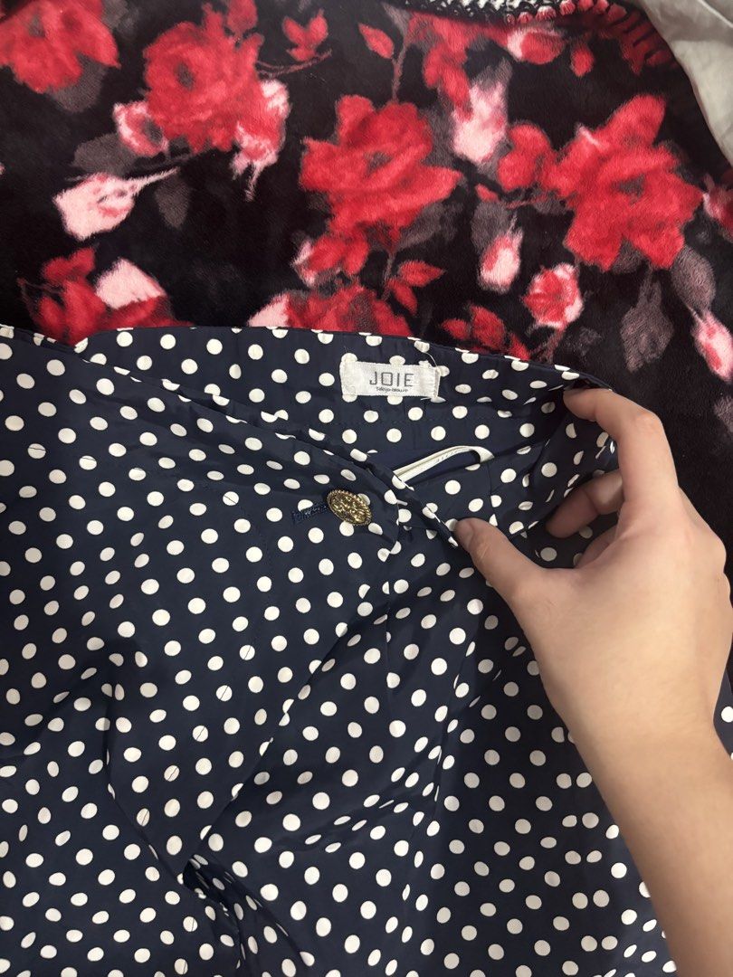 JOIE Navy Blue Polka Dot Skirt (Category: Skirts) located in Cavite. Submitted by raf.nomnom (Listing ID 1461400627, Image 3). Description: - Navy blue skirt with classic white polka dots - Elegant gold button closure at the waist - Unique dark blue panel detail on the side - Versatile for both casual outings and dressy events - Comfortable and fashionable design.