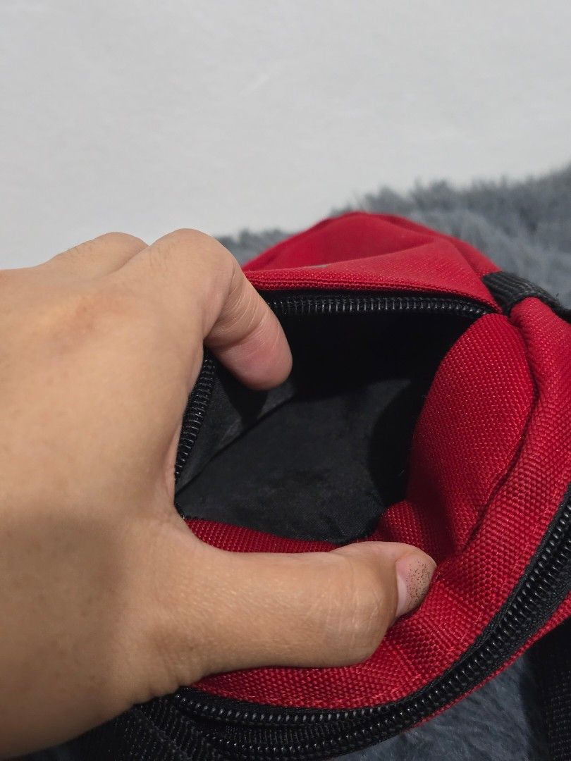 Jordan Air Red Crossbody Bag (Category: Sling Bags) located in Manila. Submitted by trialfindsmanila (Listing ID 1461501656, Image 3). Description: This is authentic 💯 from US Very in good condition - Stylish red Air Jordan crossbody bag - Main zippered compartment for secure storage - Additional smaller front zippered pocket for quick access - Adjustable strap for a comfortable, customized fit - Ideal for carrying your daily essentials on the g