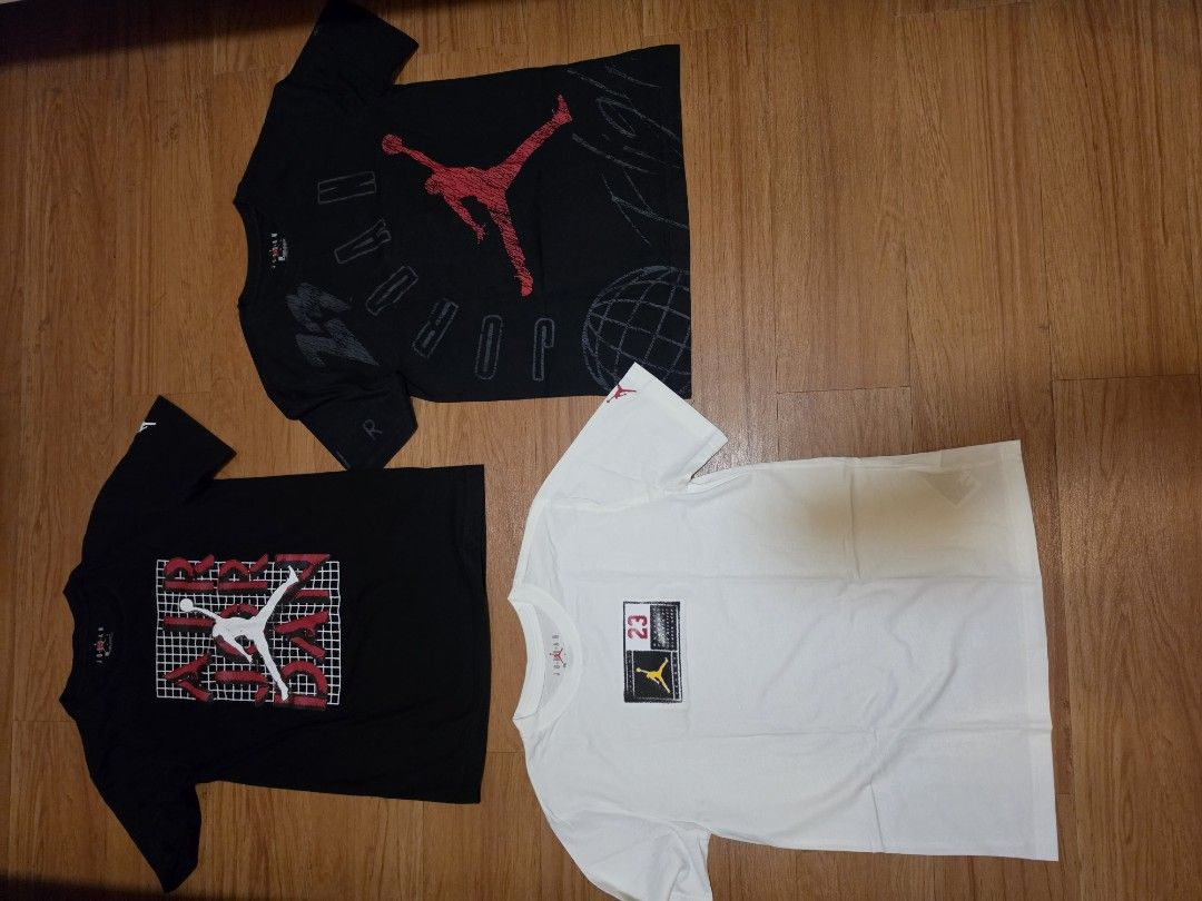 Jordan T-Shirts (3 pcs) (Category: Babies & Kids Fashion) located in Manila. Submitted by philgabjhn (Listing ID 1461346260, Image 1). Description: - Set of 3 Jordan t-shirts - Includes 2 black shirts with graphics and 1 white shirt - All shirts are size Large (L) - Ideal for casual everyday wear - Feel free to ask any questions - get all for only 2,000 or 700 each - rfs: decluterring.