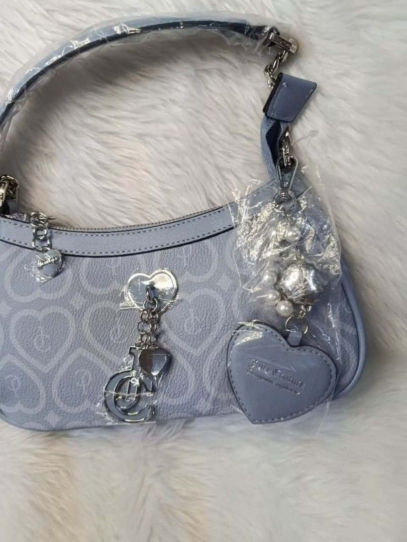 Juicy Couture Bubble Pop Shoulder Bag - Dusty Blue (Category: Shoulder Bags) located in Cavite. Submitted by mahthriftshop (Listing ID 1461489445, Image 2). Description: - Authentic Juicy Couture shoulder bag - Color: Dusty blue - All-over JC heart monogram pattern - Adorable heart and pearl charms included - Secure zipper closure - Interior lined with pink fabric - Brand new with original tags attached.