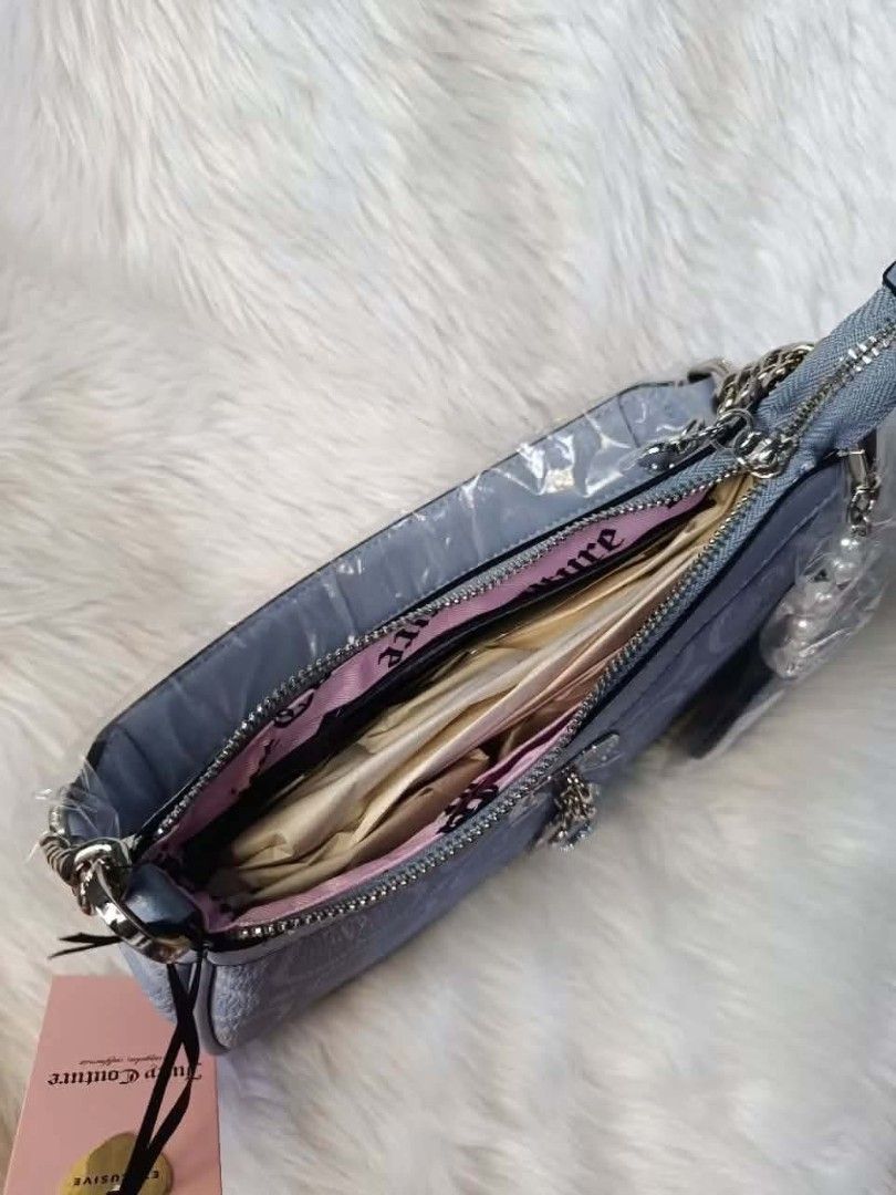Juicy Couture Bubble Pop Shoulder Bag - Dusty Blue (Category: Shoulder Bags) located in Cavite. Submitted by mahthriftshop (Listing ID 1461489445, Image 3). Description: - Authentic Juicy Couture shoulder bag - Color: Dusty blue - All-over JC heart monogram pattern - Adorable heart and pearl charms included - Secure zipper closure - Interior lined with pink fabric - Brand new with original tags attached.