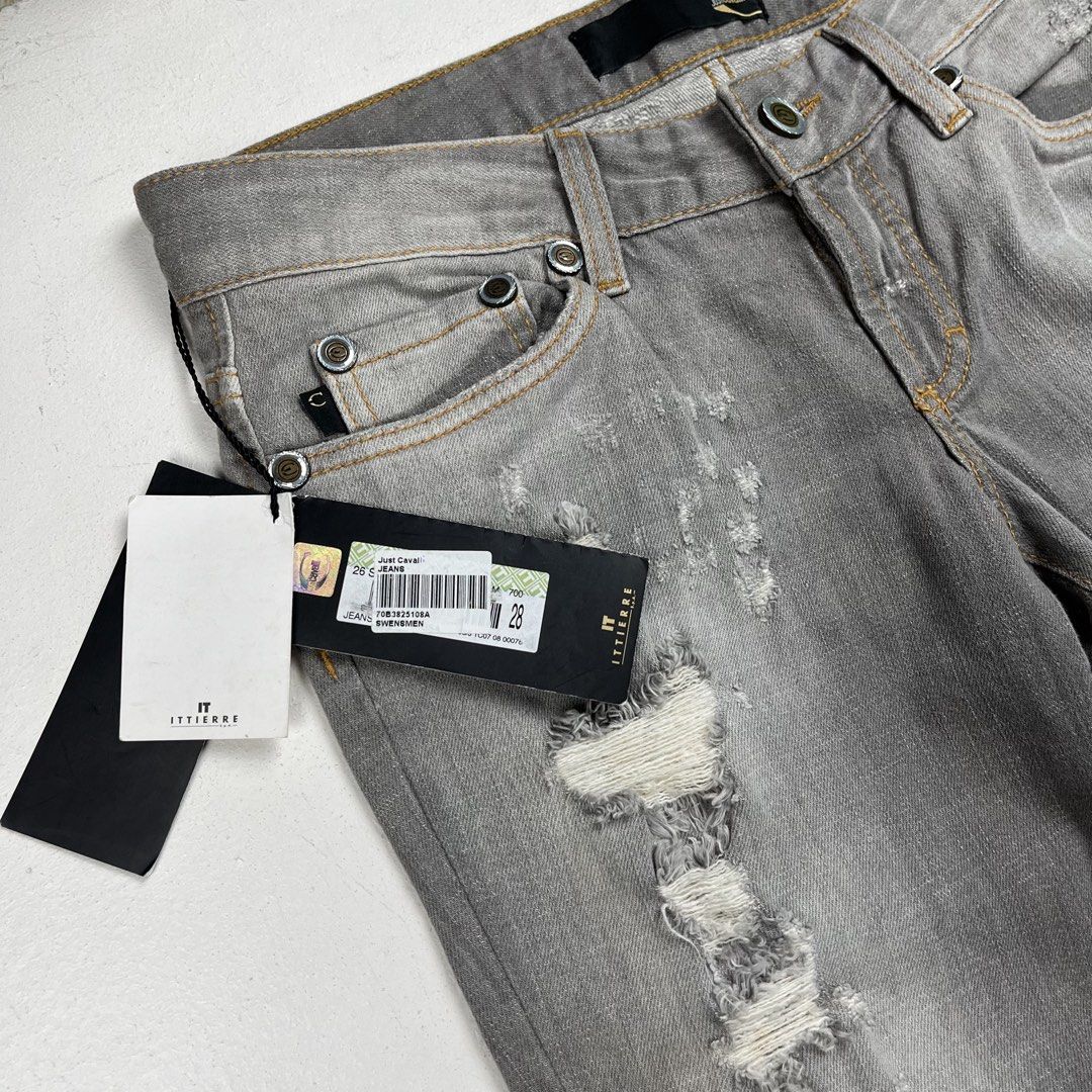 Just Cavalli Grey Distressed Slim Denim Jeans (Category: Jeans) located in Quezon City. Submitted by forgarments (Listing ID 1461415332, Image 3). Description: Just Cavalli Grey Distressed Slim Denim Jeans Excellent Condition with tag - The fabric under the distressing is removed Size: 42 Waist: 30 inches Front rise: 7.5 inches thigh: 10 inches knee: 7.5 inches Inseam: 34 inches Length: 41.5 inches Hem: 7.5 inches A pair of slim-fit denim jeans r
