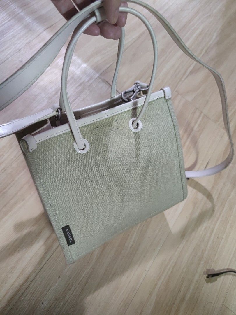 Kangol Tote Bag Canvas Leather Trim, Small (Category: Tote Bags) located in Dagupan City. Submitted by jhazrightshop (Listing ID 1461442345, Image 2). Description: - Light green canvas tote bag by Kangol - Cream leather trim and handles - Detachable shoulder strap included - Iconic kangaroo logo on the front - Small Kangol tag on the side - Ideal for everyday use.