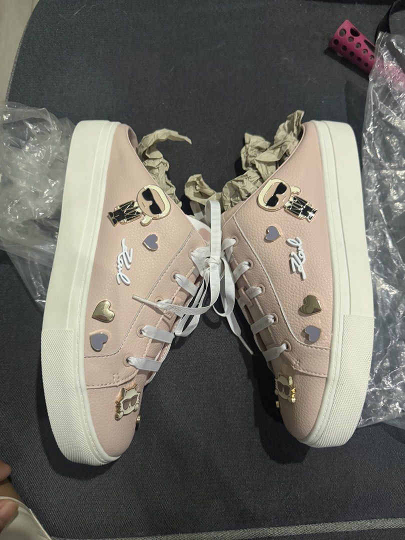 Karl Lagerfeld (Category: Sneakers) located in Marikina City. Submitted by tharyl1824 (Listing ID 1461333312, Image 1). Description: - Adorable pink Karl Lagerfeld sneakers - Features cute charms: sunglasses and hearts - Classic white laces - Chunky white sole for a stylish look - Perfect for adding a fun touch to casual outfits.