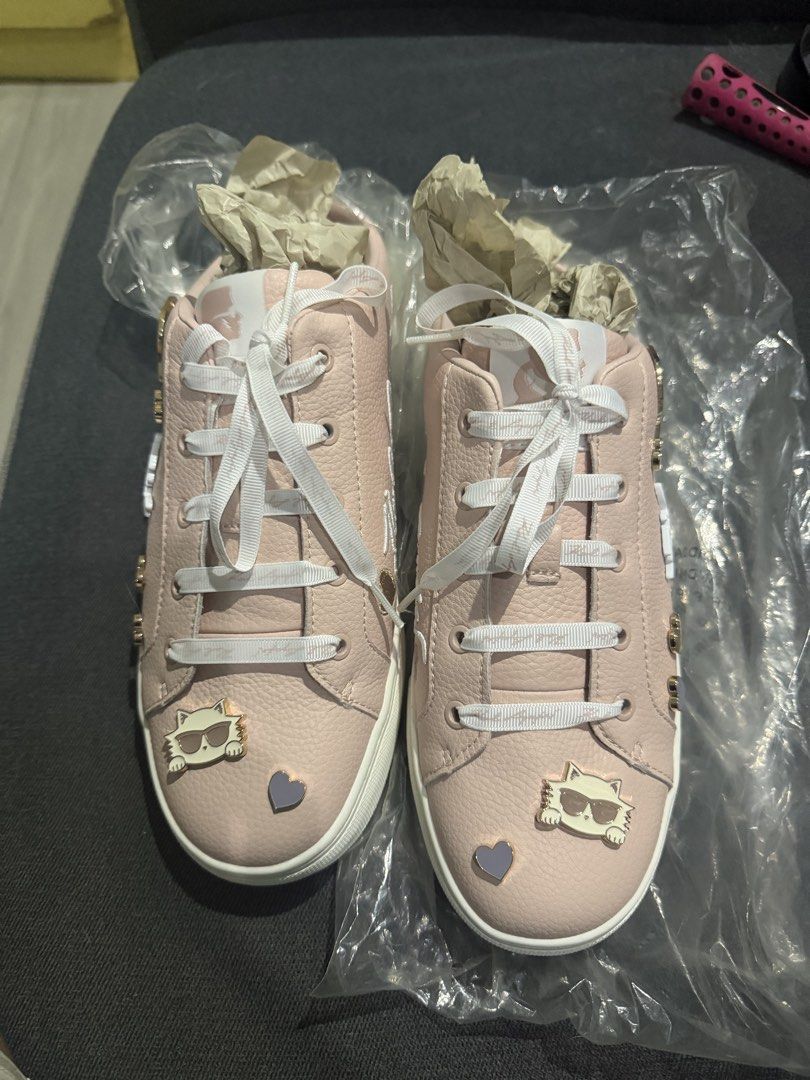 Karl Lagerfeld (Category: Sneakers) located in Marikina City. Submitted by tharyl1824 (Listing ID 1461333312, Image 2). Description: - Adorable pink Karl Lagerfeld sneakers - Features cute charms: sunglasses and hearts - Classic white laces - Chunky white sole for a stylish look - Perfect for adding a fun touch to casual outfits.