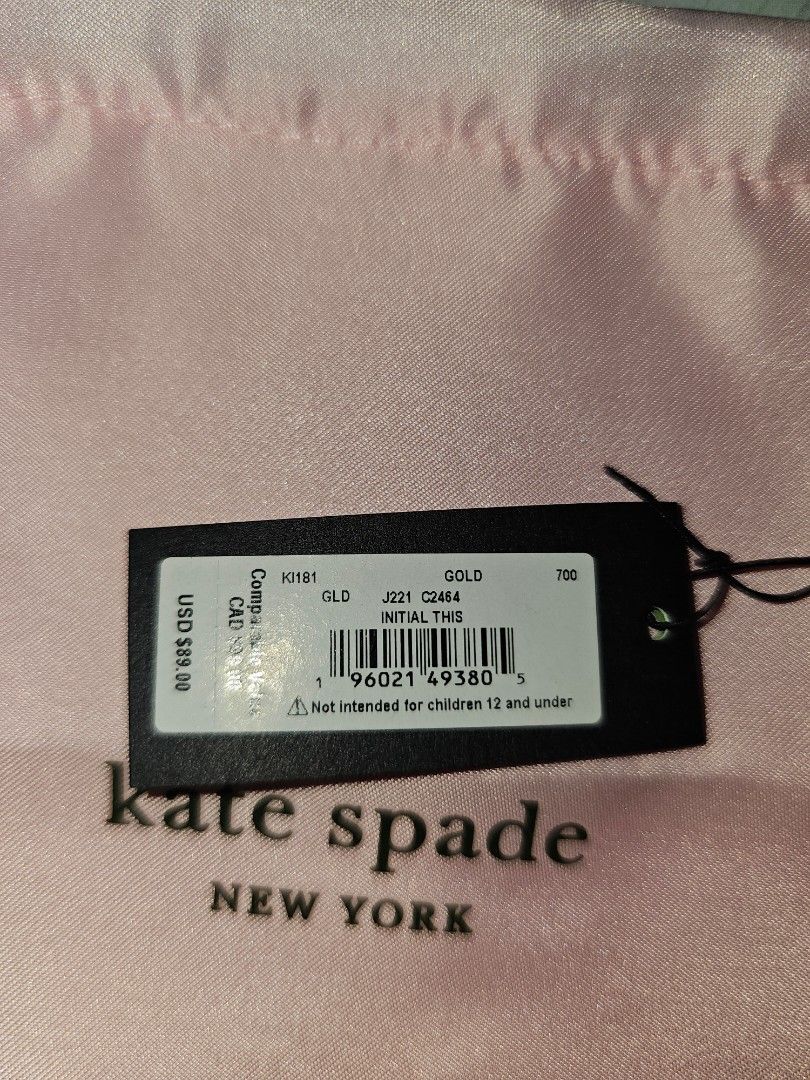 Kate Spade New York Gold Initial Necklace (Category: Necklaces) located in Manila. Submitted by tokyo_thv (Listing ID 1461340986, Image 2). Description: - Genuine Kate Spade gold chain necklace - Features a stylish 'K' initial charm - Comes with original Kate Spade dust bag and tag - Original retail price: $89.00 USD - Makes a wonderful gift idea.