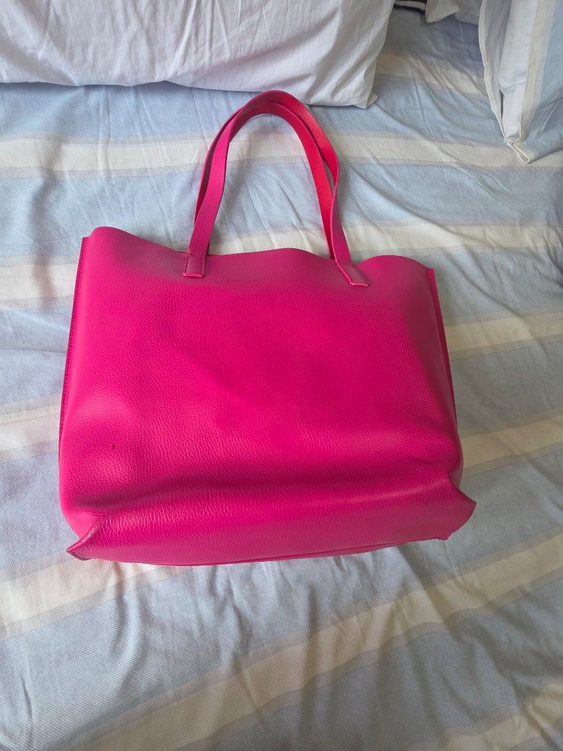 Kate Spade Pink Leather Tote Bag (Category: Tote Bags) located in Pasig City. Submitted by martymarcelo26 (Listing ID 1461386707, Image 2). Description: - Bright pink Kate Spade tote bag - Genuine leather material - Interior pocket with zipper closure - Sturdy and reliable handles - Spacious interior for all your essentials - Ideal for everyday use or as a vibrant accessory.