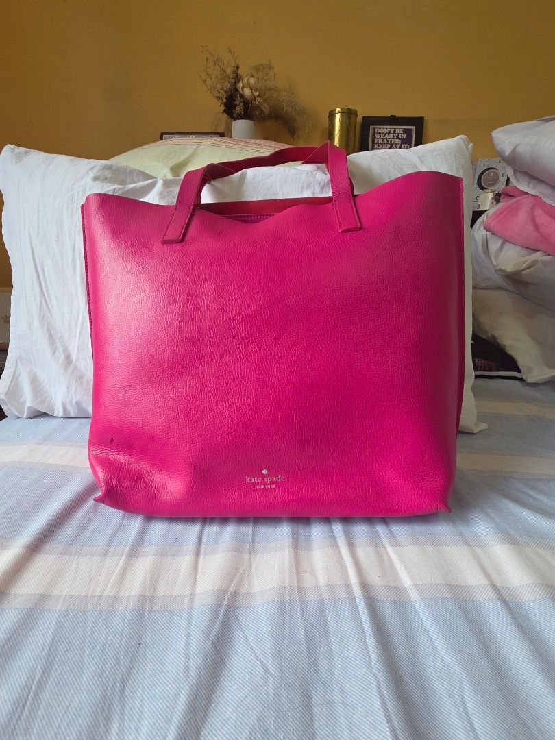 Kate Spade Pink Leather Tote Bag (Category: Tote Bags) located in Pasig City. Submitted by martymarcelo26 (Listing ID 1461386707, Image 1). Description: - Bright pink Kate Spade tote bag - Genuine leather material - Interior pocket with zipper closure - Sturdy and reliable handles - Spacious interior for all your essentials - Ideal for everyday use or as a vibrant accessory.
