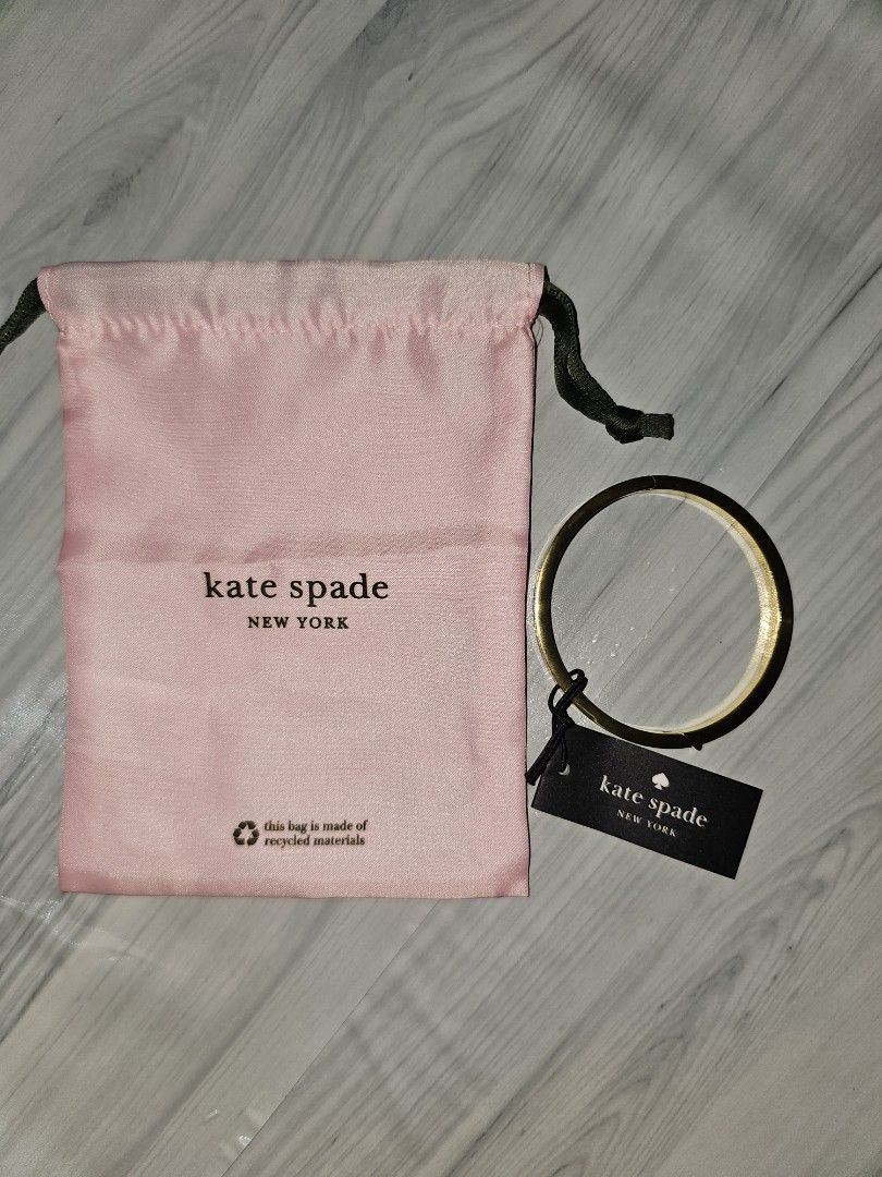 Kate Spade Spot The Spade Bangle (Category: Bracelets) located in Manila. Submitted by tokyo_thv (Listing ID 1461340761, Image 1). Description: - Genuine gold bangle - Delicate pink enamel detailing - Features cute spade cutouts - Comes with original dust bag and tag - Size J - Original Retail: USD $79.00 / CAD $89.00.
