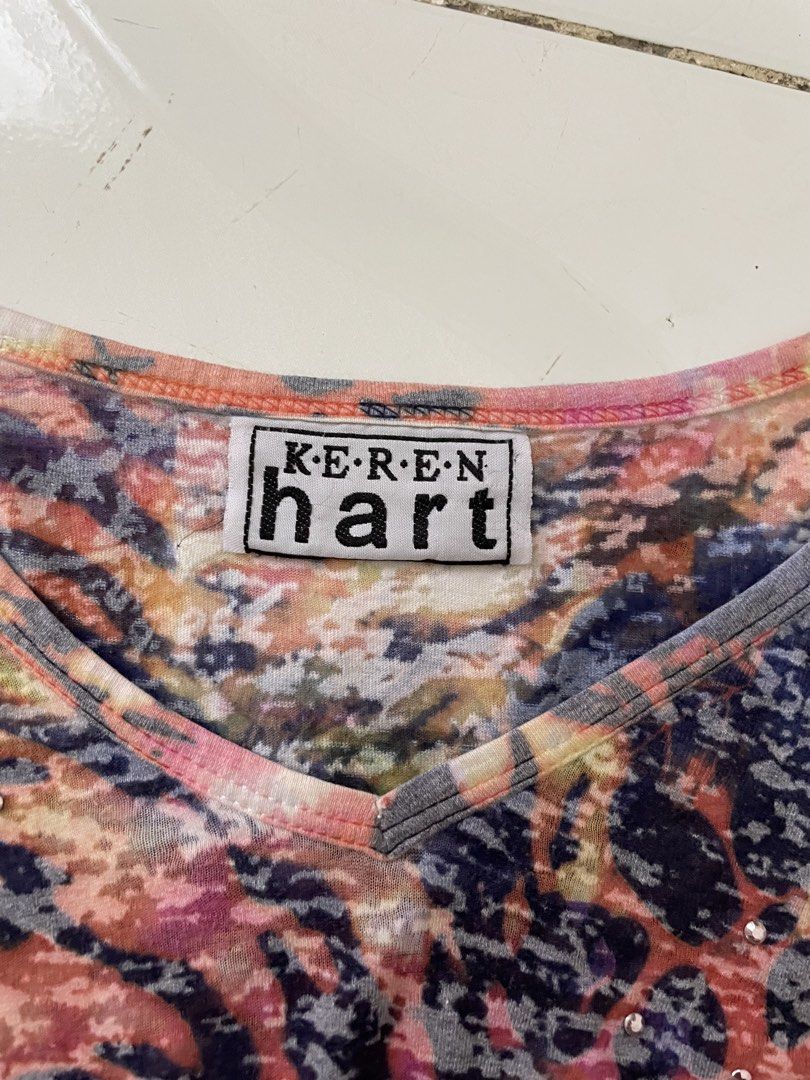Keren Hart Long Sleeve V-Neck Top (Category: Longsleeves) located in Siniloan. Submitted by rethr1ft (Listing ID 1461415666, Image 2). Description: - Fun and colorful long-sleeved top by Keren Hart. - Features a vibrant abstract print with animalistic patterns. - Scattered sparkly embellishments for extra flair. - Grey V-neckline trim. - Adds a pop of color to any outfit..
