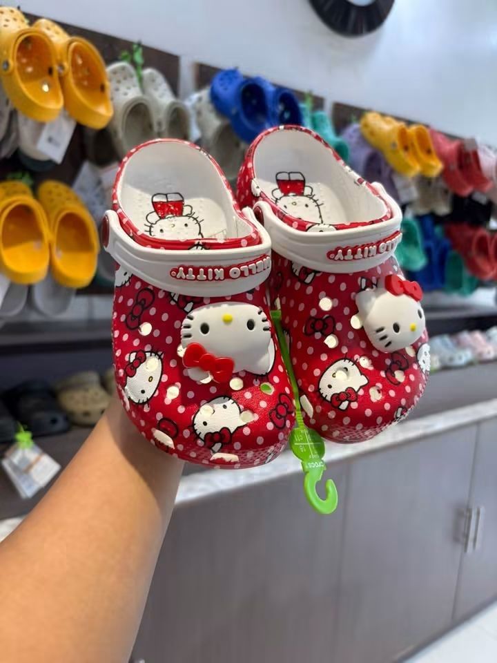 Kids Hello Kitty Crocs & Plain Crocs (Category: Babies & Kids Fashion) located in Cebu City. Submitted by madeskartegirl (Listing ID 1461337092, Image 2). Description: - Adorable kids' Crocs available! - Features: Red Kitty with polka dots & 3D charm - Also available: Plain beige and pink pairs - Condition: Great, possibly new - Perfect for: Indoor play or outdoor adventures - Benefits: Easy to clean, comfortable for little feet CLASSIC CLOG FOR 