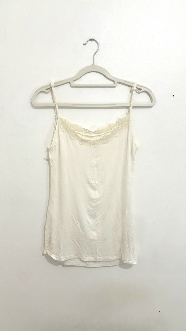 Lace-Trimmed Spaghetti Camisole Top (Category: Sleeveless) located in Caloocan City. Submitted by buymethisandthat (Listing ID 1461340072, Image 1). Description: ✨ Lace-Trimmed Spaghetti Camisole Top - ₱79 📌 CONDITION • Condition: 6/10 • Flaws: Yellowish, wash wear along the lace 📏 SIZE • Tag Size: No size tag • Recommended: Fits Small to Medium (Adjustable Straps).