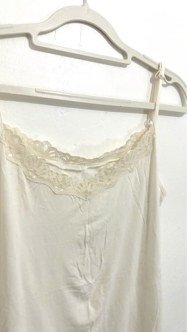 Lace-Trimmed Spaghetti Camisole Top (Category: Sleeveless) located in Caloocan City. Submitted by buymethisandthat (Listing ID 1461340072, Image 2). Description: ✨ Lace-Trimmed Spaghetti Camisole Top - ₱79 📌 CONDITION • Condition: 6/10 • Flaws: Yellowish, wash wear along the lace 📏 SIZE • Tag Size: No size tag • Recommended: Fits Small to Medium (Adjustable Straps).
